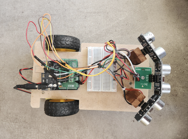 Hand-Following Car: Arduino and Ultrasonic Sensors Powered - Tinkercad